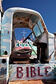 Niland, California - Salvation Mountain, a desert hillside covered with religious messages, created by Leonard Knight  An old truck is painted with religious slogans