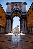 A human statue in front of Arco da Victoria in the Baixa district in Lisbon