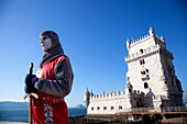 A human sculpture in front of Torre de Belem, Lisbon, Portugal