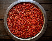 Closeup of a bowl of red chillies Approximately 300 Burmese refugees in Thailand are members of the indigenous group known as the Longnecks The largest of the three villages where the Longnecks live is called Nai Soi, located near Mae Hong Son City Longne