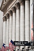 Wall Street sign in front of New York Stock Exchange in Manhattan, New York City, United States of America