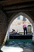 Gondolier at work, Venice, Italy