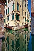 Building reflected on a canal, San Polo, Venice, Italy