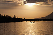 Boat at sunset in Kampot at the Prek Thom River, Kampot province, Cambodia, Asia