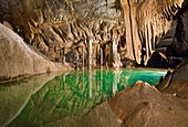 Stalagmites stalactites and subterranean lake, Krizna Jama karst cave system, Loska Dolina, Gorenjska, Krain, Slovenia