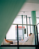 Woman on a lounger in relaxation room of a spa, Langenlois, Lower Austria, Austria