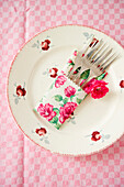 Cake forks resting on a decorative plate, Table, Place settings, Decoration