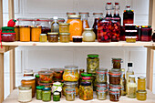 Food larder with shelves of homemade products, Homemade