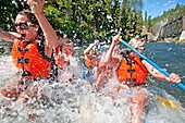 Jed Weber, Elijah Weber, Tatiana Greener, Nic Houser, Shannon Otto and Nikki Tate whitewater rafting the Cabarton section on the North Fork of the Payette River which is rated Class 3 and located near the city of Cascade in central Idaho
