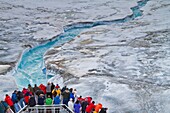 The Lindblad Expedition ship National Geographic Explorer near glacial run-off in the Svalbard Archipelago, Norway