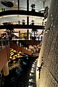 The Waterfall inside Dubai Mall runs through the entire height of the mall, traversing all four levels, and is adorned with art sculptures of human divers made of fiberglass to create a dynamic visual spectrum that complements the rhythmic flow of water. 