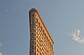 The Flatiron Building built in 1902 in the late afternoon sunlight, Manhattan, New York City
