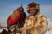 Kazak eagle hunter from far western province of Bayan Olgii compete in winter festival, Mongolia