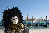 Venice, man in mask, gondolas
