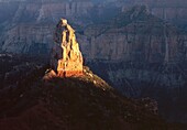 Sunset defines Mt  Hayden against shadowed canyon walls, view south from Point Imperial, North Rim, Grand Canyon National Park, Arizona, USA