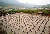 Kung fu students practice synchronized kung fu at the Ta Gou academy in Henan Province, Shaolin