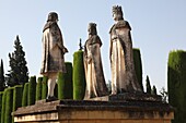 Statues of Queen Isabella, King Ferdinand and Christopher Columbus in the Alcazar gardens, Cordoba, Andalusia, Spain