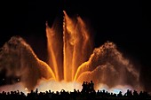 Tourists enjoying the light show of the Plaza de Espana in Barcelona, Catalonia, Spain