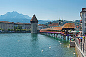View of Chapel bridge with water tower and Pilatus mountain, Lucerne, Lucerne, Switzerland, Europe