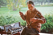 China,Beijing,Temple of Heaven Park,Man Playing Erdu Traditional Stringed Instrument
