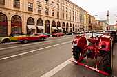 Red tractor, Fiat Dino Coupe and Ferrari in Maximilian street, Munich, Upper Bavaria, Bavaria, Germany