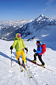 Two cross-country skier ascending to mount Sulzspitze, Tannheim Mountains, Allgaeu Alps, Tyrol, Austria