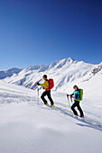 Two cross-country skiers ascending to mount Kreuzspitze, East Tyrol, Tyrol, Austria