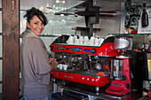 Barista Elisa preparing a perfect espresso at stylish Bar Cheri, Chioggia, Veneto, Italy, Europe