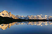 Mont Blanc range reflecting in a mountain lake, Mont blanc range, Chamonix, Savoy, France