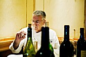 The cheff Jean Pierre Bruneau testing some wines, Bruneau restaurant, , Bruxelles, Brussels, Belgium.