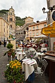 An outdoor restaurant in the town of Amalfi on the Gulf of Salerno in southern Italy