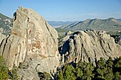 Elijah Weber rock climbing Swiss Cheese which is rated 5,7 and located on the Anteater at The City Of Rocks National Reserve near the town of Almo in southern Idaho