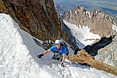 Elijah Weber climbing The June Couloir on the North Face of Williams Peak high above the Sawtooth Valley in the Sawtooth Mountains near the town of Stanley in central Idaho