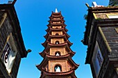 The Tran Quoc Pagoda with statues of gods inside at West Lake