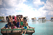 Young Children Playing at Back of Boat, Semporna, Borneo