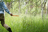 Man Running in Woods With Feather in Hand