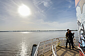 Young couple on the river elbe at the lighthouse of Blankenese, Hamburg, north Germany, Germany