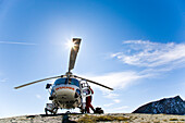 Helicopter on landing field near Stuedl hut, Grossglockner, Tyrol, Austria