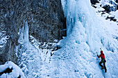 Man ice climbing at the Kotalmfall, Achenkirch, Tyrol, Austria