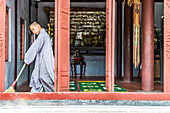 Young monk at the tomb of the emperor Thien Mu, near the Imperial city of Hue, Vietnam, Asia