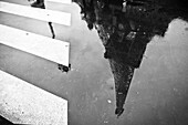 Eiffel Tower Reflected in Puddle, Paris, France