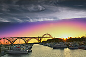 Newport Harbor and Newport Bridge at sunset, Silhouette of the bridge against the sky