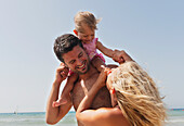 A Mother And Father On The Beach With Their Young Daughter, Tarifa Cadiz Andalusia Spain