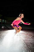 Ice figure skater on ice rink