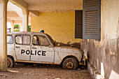 Old, decrepit police car, Morondava, Madagascar, Africa