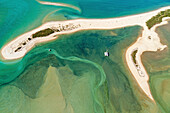 blocked for illustrated books in Germany, Austria, Switzerland: Aerial view of the Awaroa Inlet with catamaran, blue-green marine water, Abel Tasman National Park, South Island, New Zealand