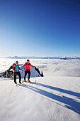 Two backcountry skiers ascending to hut Gruttenhuette, Kaiser-Express, Rote-Rinn-Scharte, Wilder Kaiser, Kaiser mountain range, Tyrol, Austria
