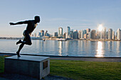 Statue of Olympic runner, Harry Jerome in Stanley Park at sunrise, Vancouver, British Columbia, Canada