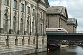 High- speed train passing by the Pergamon Museum in Berlin , Berlin, Germany