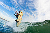 California, Huntington Beach, Surfer catches air on a fun playful wave. FOR EDITORIAL USE ONLY.